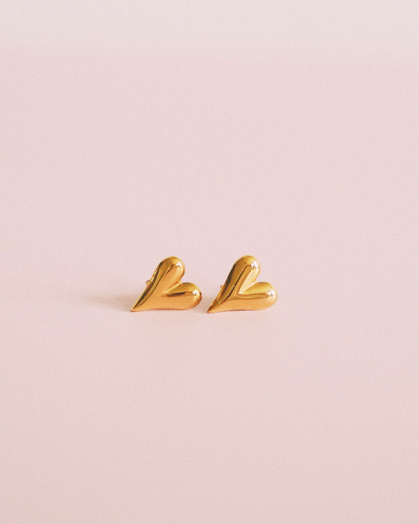 18K gold plated waterproof mini gold heart stud earrings | ella iconic® UK