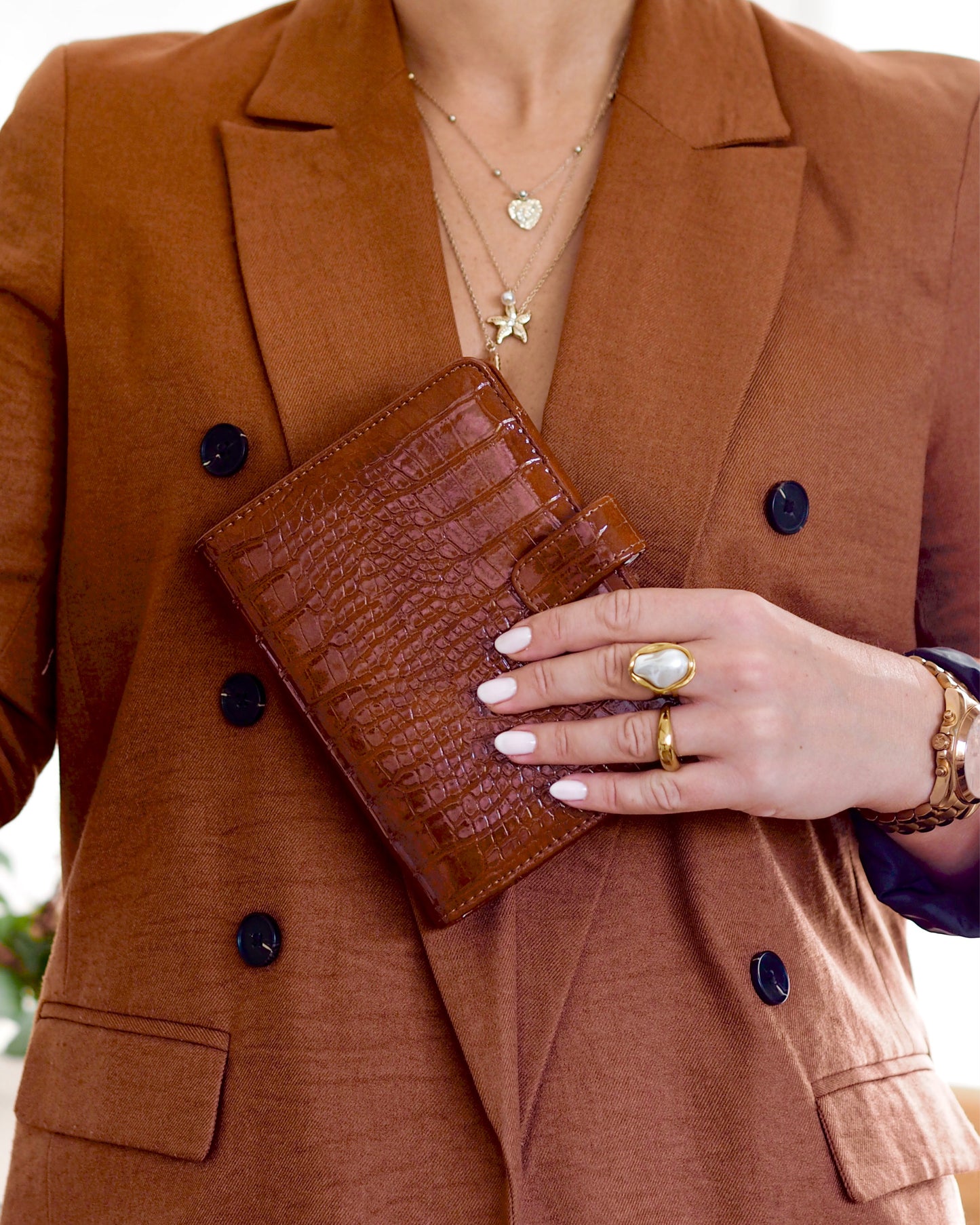 Close-up of personal size A6 cognac croc vegan leather ring binder agenda showing tab closure and embossed texture. By ella iconic® UK.